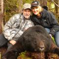 Todd and wife Gloria with Todds big boar